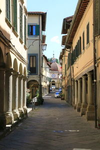 Narrow street amidst buildings in town