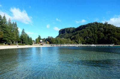 Scenic view of swimming pool by sea against sky