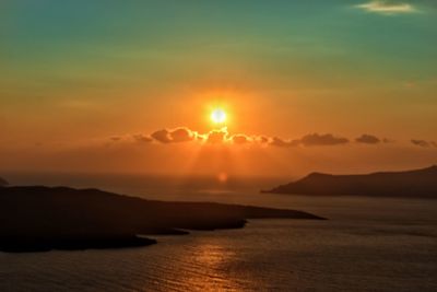 Scenic view of sea against romantic sky at sunset