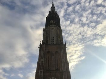Low angle view of clock tower against sky