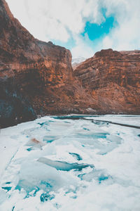 Scenic view of mountains against sky during winter