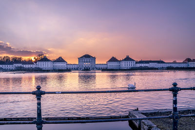 Scenic view of river against sky during sunset