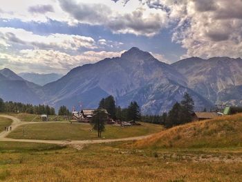 Scenic view of landscape and mountains against sky