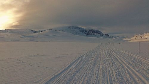 Scenic view of snow covered mountain against sky