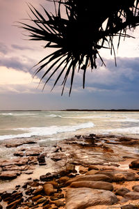 Scenic view of sea against cloudy sky