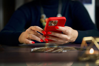 Midsection of man using mobile phone