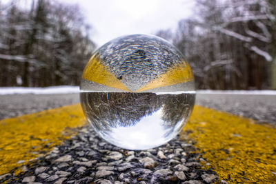 Close-up of crystal ball on snow