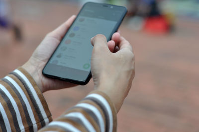 Close-up of man using mobile phone