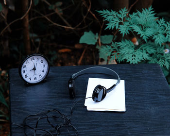 Close-up of clock on table