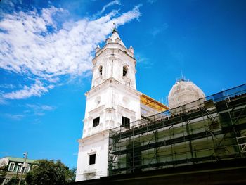 Low angle view of building against blue sky