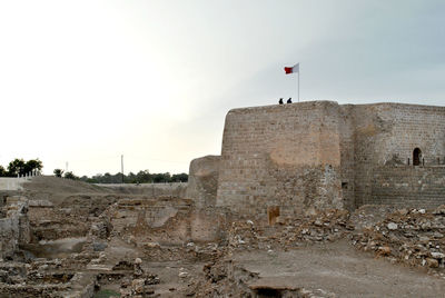 Built structure on beach against sky