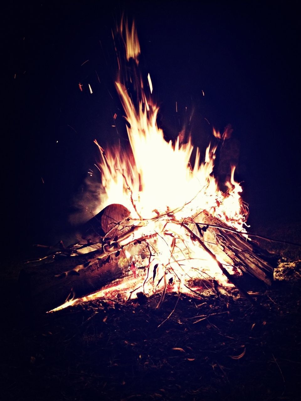 fire - natural phenomenon, burning, night, flame, heat - temperature, glowing, long exposure, motion, bonfire, sparks, fire, illuminated, campfire, firework display, firewood, exploding, firework - man made object, blurred motion, spark, dark