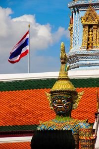 Low angle view of multi colored wall against sky