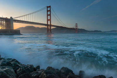 View of suspension bridge over sea