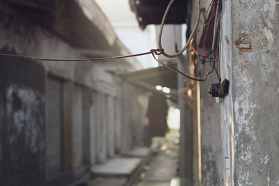 Close-up of cable hanging on wall