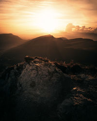 Scenic view of mountains against sky during sunset