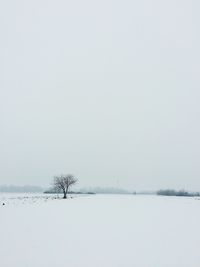 Scenic view of lake against sky during winter