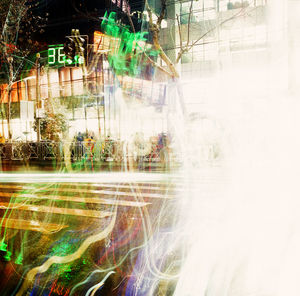 Digital composite image of city seen through glass window