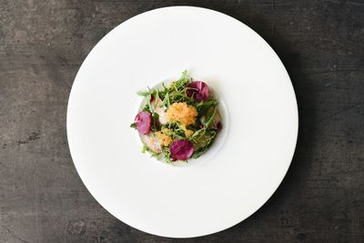 High angle view of vegetables in plate on table