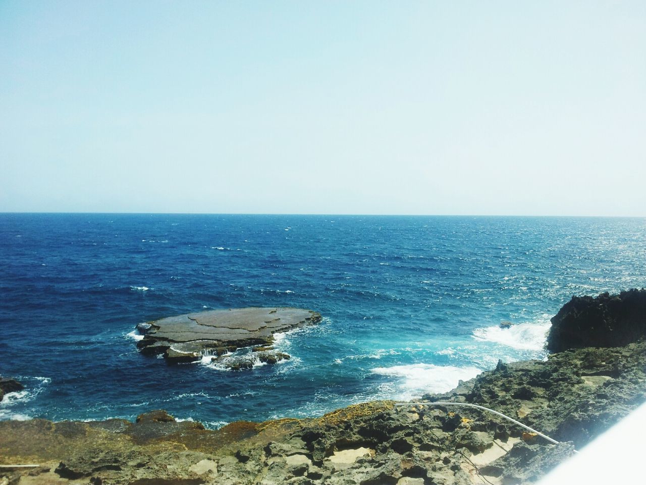 sea, horizon over water, water, clear sky, copy space, scenics, beauty in nature, tranquil scene, tranquility, nature, blue, seascape, idyllic, rock - object, wave, beach, shore, surf, coastline, day