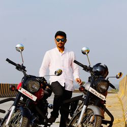 Low angle view of man riding bicycle