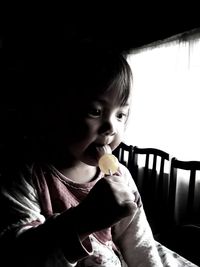Portrait of cute girl eating food