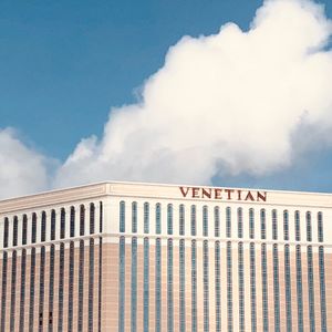 Low angle view of text on building against sky