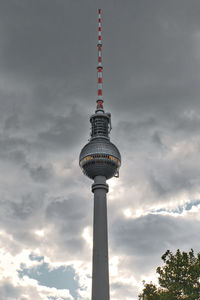 Low angle view of communications tower against sky