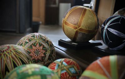 Close-up of multi colored balls on table