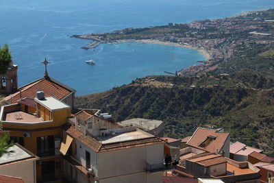 High angle view of townscape by sea