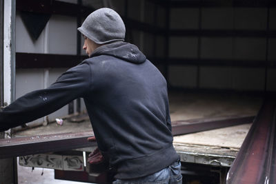 Rear view of man working
