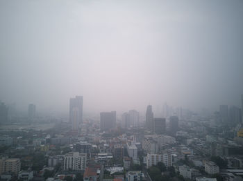 High angle view of buildings in city against sky