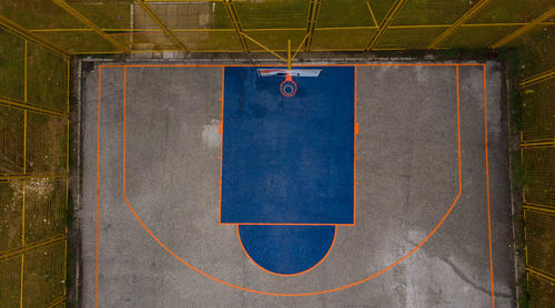 Close-up of blue rim on basketball court 