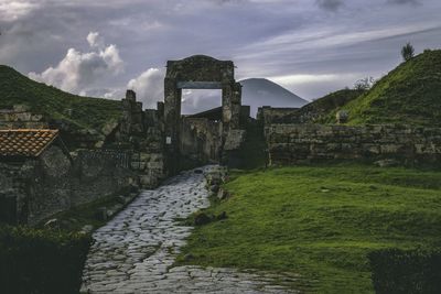 View of old ruin building against cloudy sky