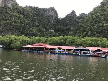 Scenic view of lake against trees and mountains