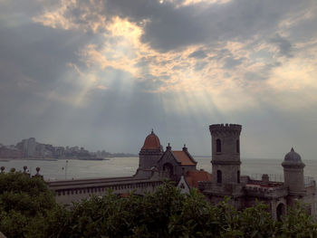 Panoramic view of temple building against sky during sunset