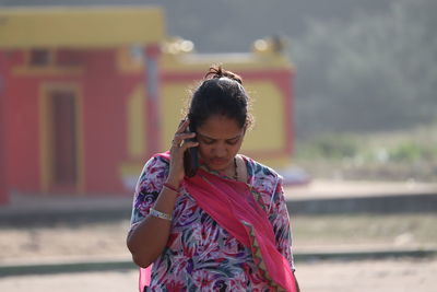 Close up shot of stylish young woman to chatting her cell phone , indian woman