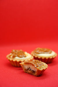 Close-up of burger against red background
