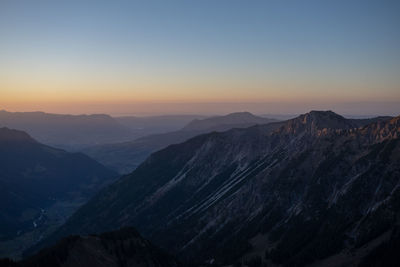 Scenic view of mountains against sky during sunset