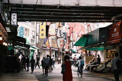 People walking on street in city