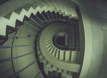 Directly below shot of spiral staircase in building