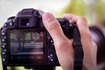 Close-up of hand holding camera