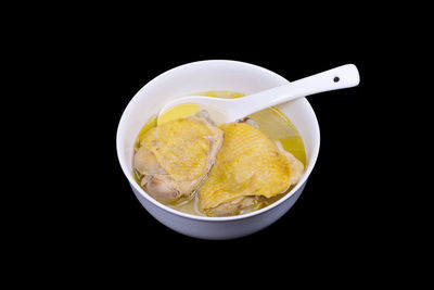 High angle view of food in bowl against black background
