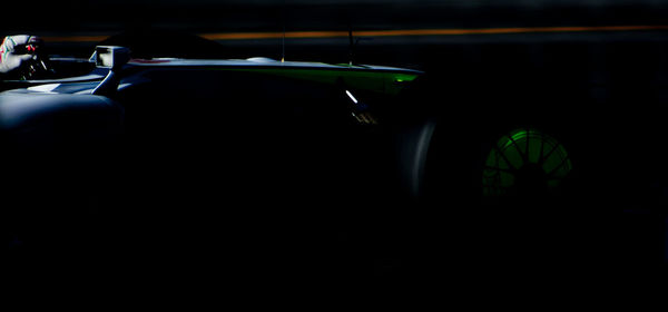 Close-up of silhouette car against sky at night