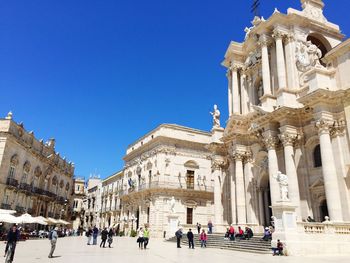 Low angle view of temple against clear blue sky