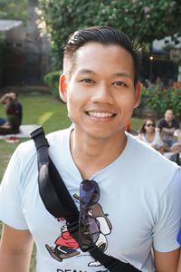 Portrait of smiling young man standing in park