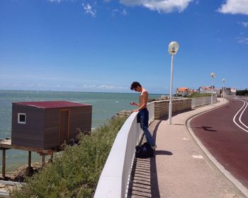 Full length of woman standing on beach