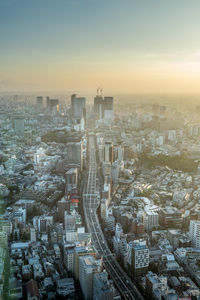 High angle view of modern buildings in city against sky