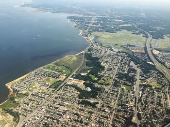 Aerial view of cityscape by sea