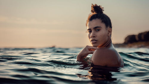 Portrait of boy swimming in sea